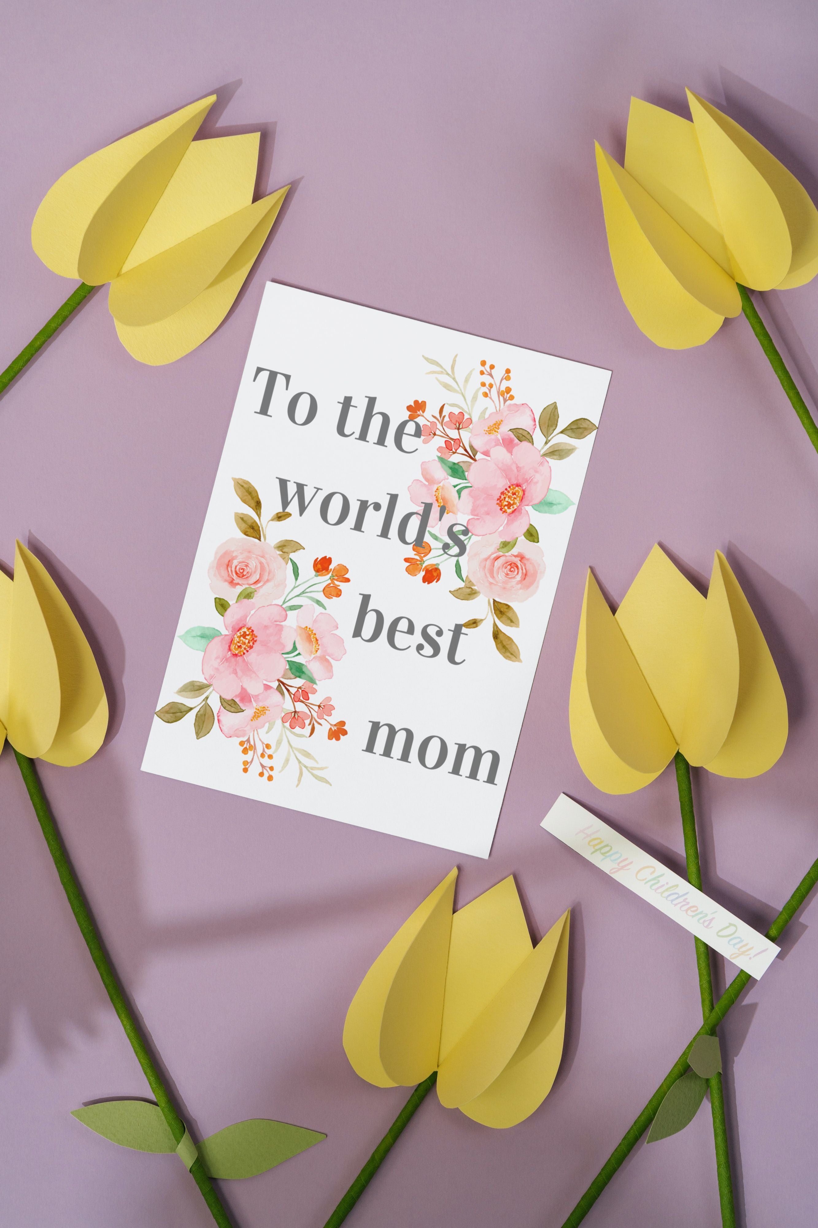 Floral card saying To the world's best mom surrounded by paper flowers.