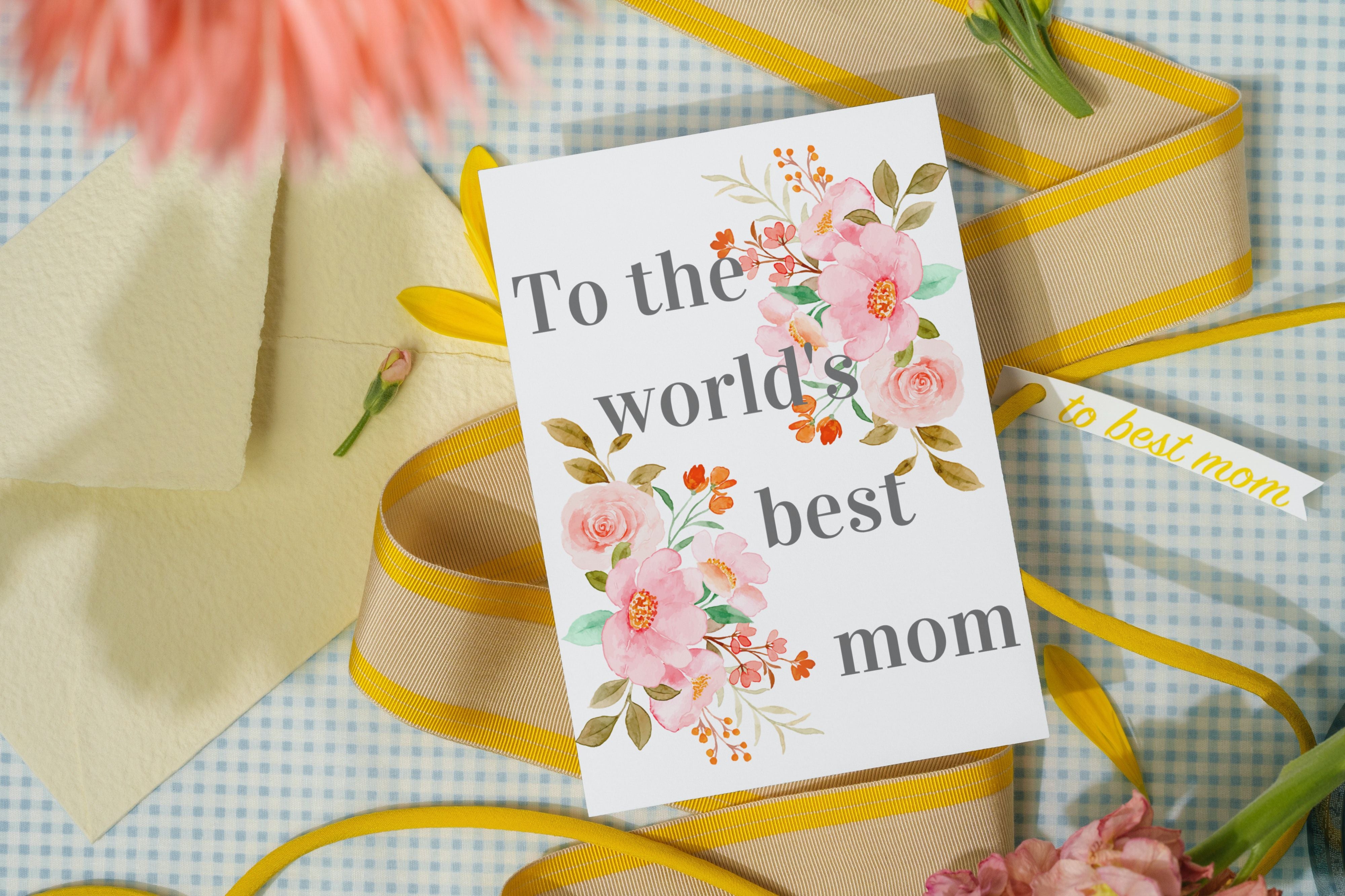 Floral card saying, To the world's best mom with ribbon, and flowers in background.